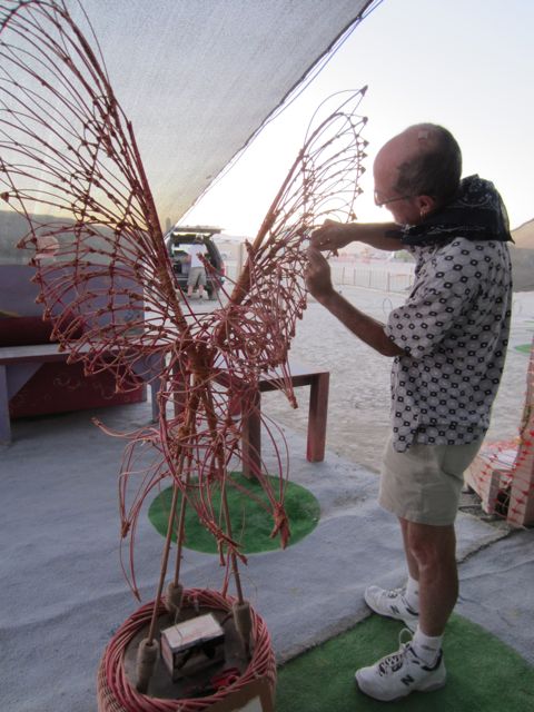 Alan attaching the first wish to the Fire Bird